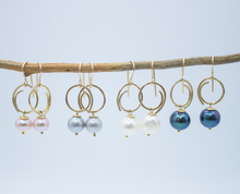Load image into Gallery viewer, Positive spiral dangle earrings with medium round fresh water pearls.
